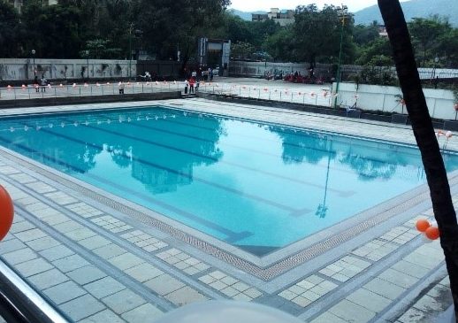 Clubhouse with swimming pool located in Thane City.